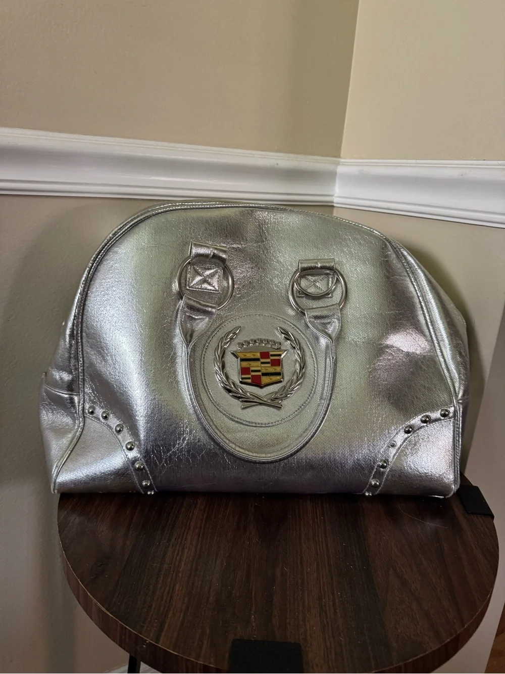 Emblem Metallic Silver Satchel Bag
